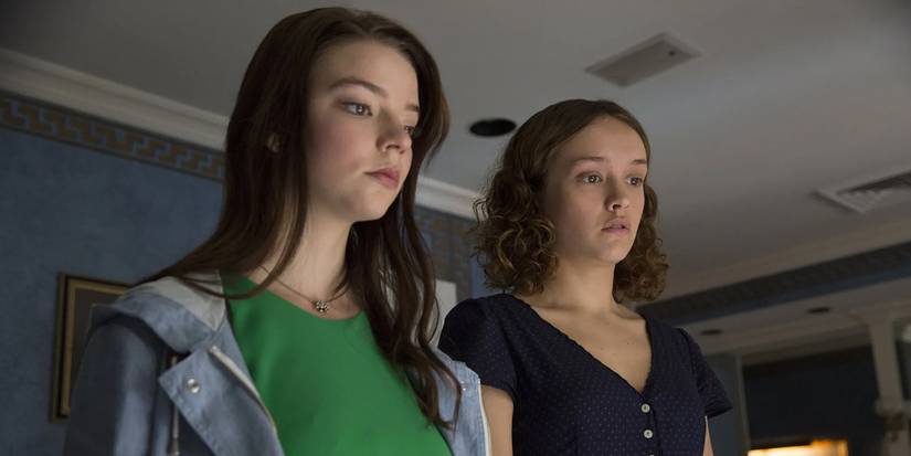 Anya Taylor-Joy and Olivia Cooke standing together in the movie Thoroughbreds