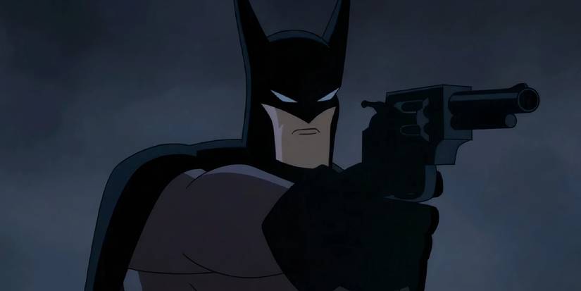 Batman segurando uma arma em Caped Crusader