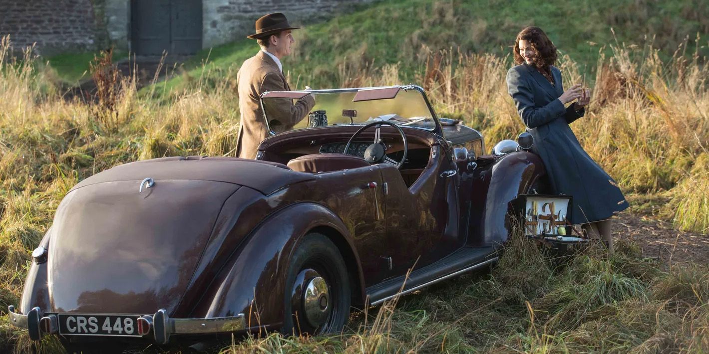 Claire and Frank standing by car in Outlander