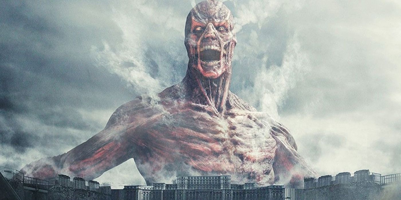 The Colossal Titan looming over the wall in the live-action Attack on Titan movie