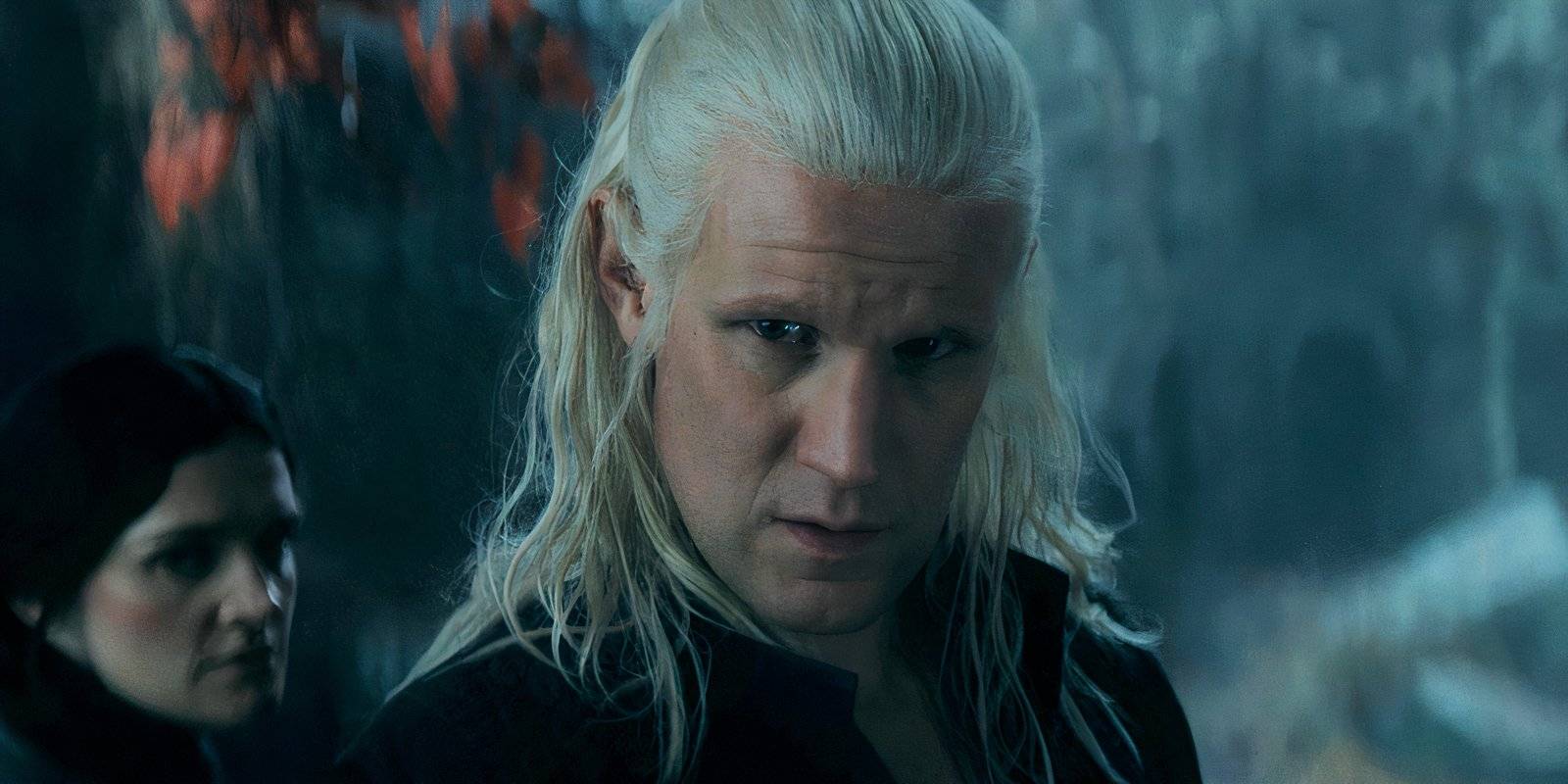 Matt Smith as Daemon placing his hand on the weirwood tree while Alys River stands behind him in the House of the Dragon season 2 finale