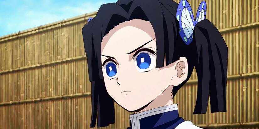 Aoi Kanzaki staring angrily ahead with a bamboo fence behind her.