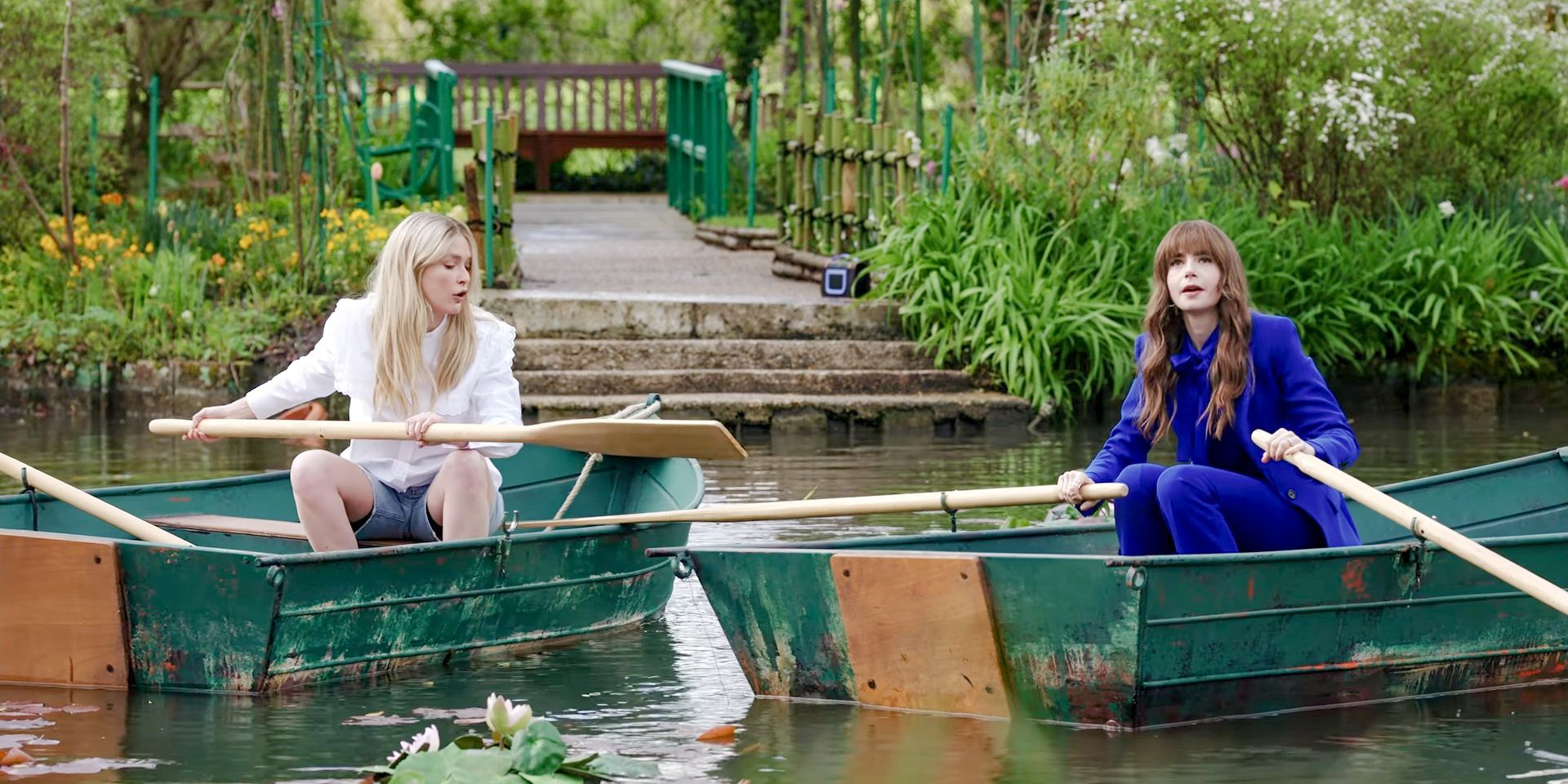 Camille and Emily having a fight in boats on the lake at Monet's house in Emily in Paris Season 4