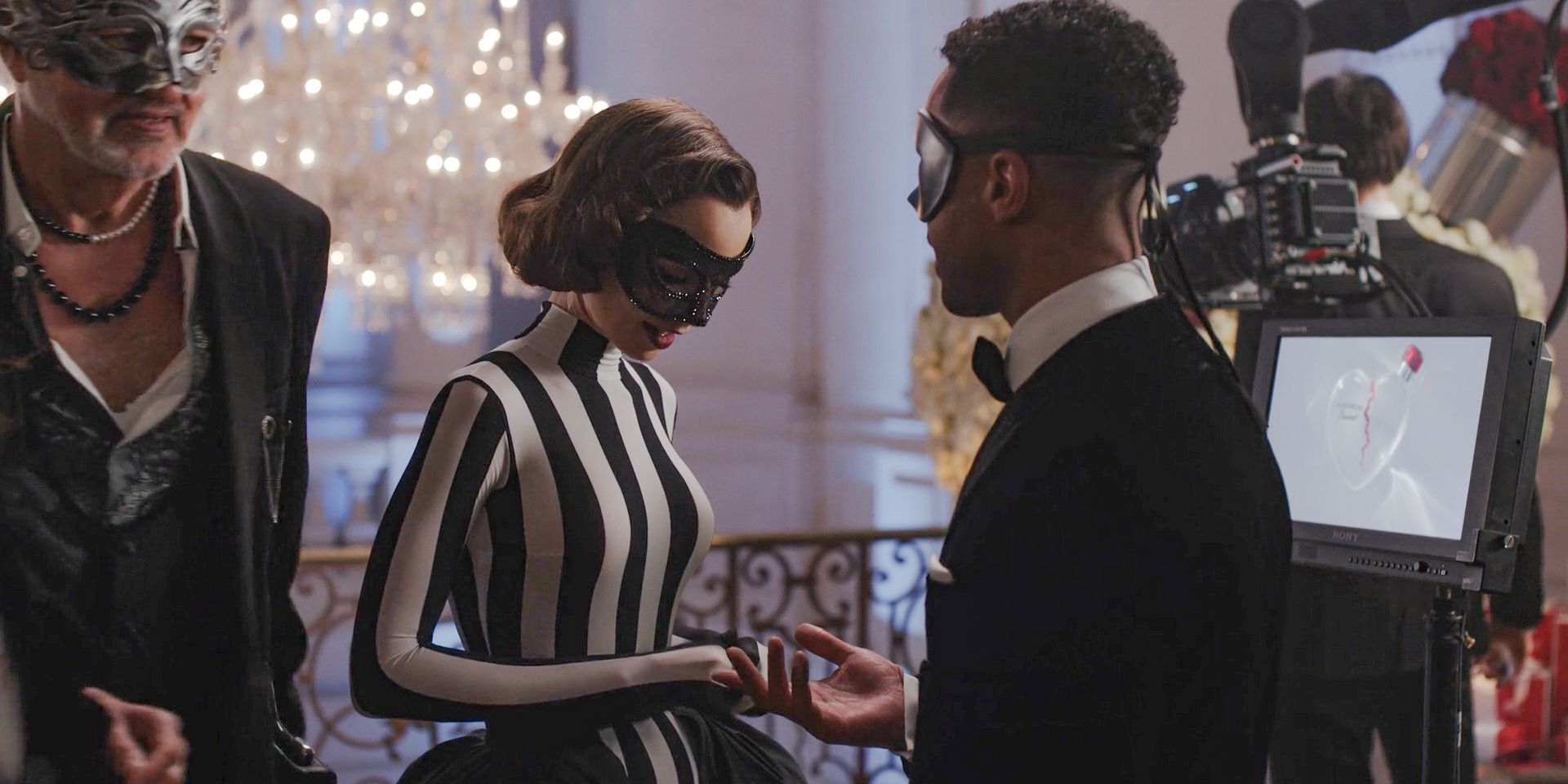 At the masquerade ball, Alfie (Lucien Laviscount) invites Emily (Lily Collins) to dance in Emily in Paris Season 4