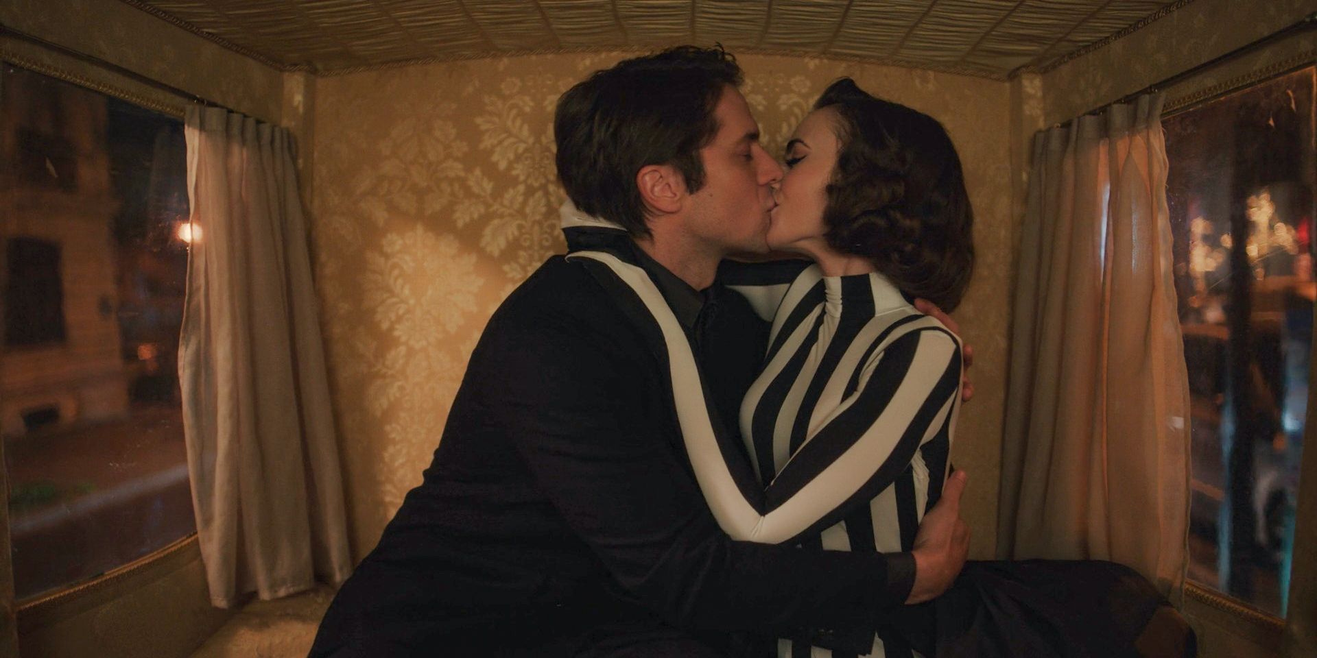 In a carriage, Gabriel and Emily share a passionate kiss in Emily in Paris Season 4