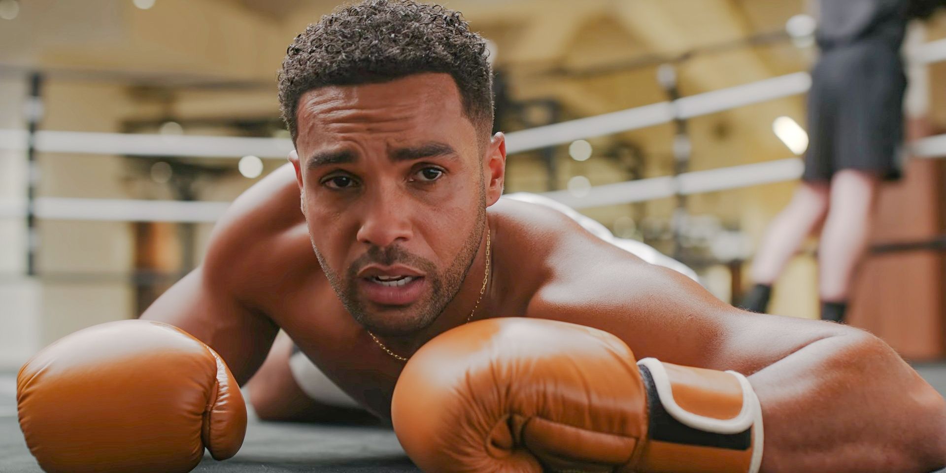 Alfie (Lucien Laviscount) knocked out in the ring while practicing boxing in Emily in Paris Season 4