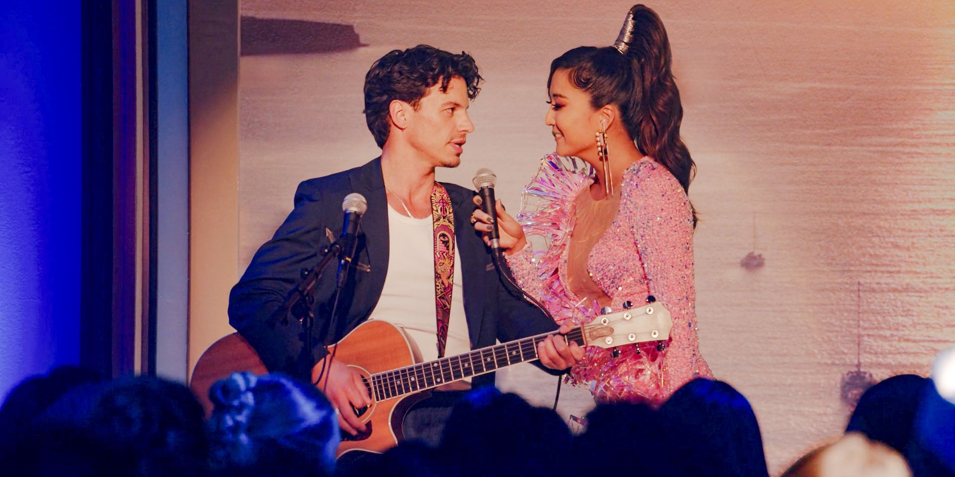 Benoît (Kevin Dias) and Mindy (Ashley Park) connect lovingly during their performance on stage in Emily in Paris Season 4