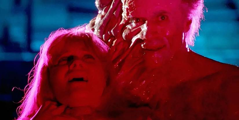 Deformed scienctist holding woman hostage in From Beyond