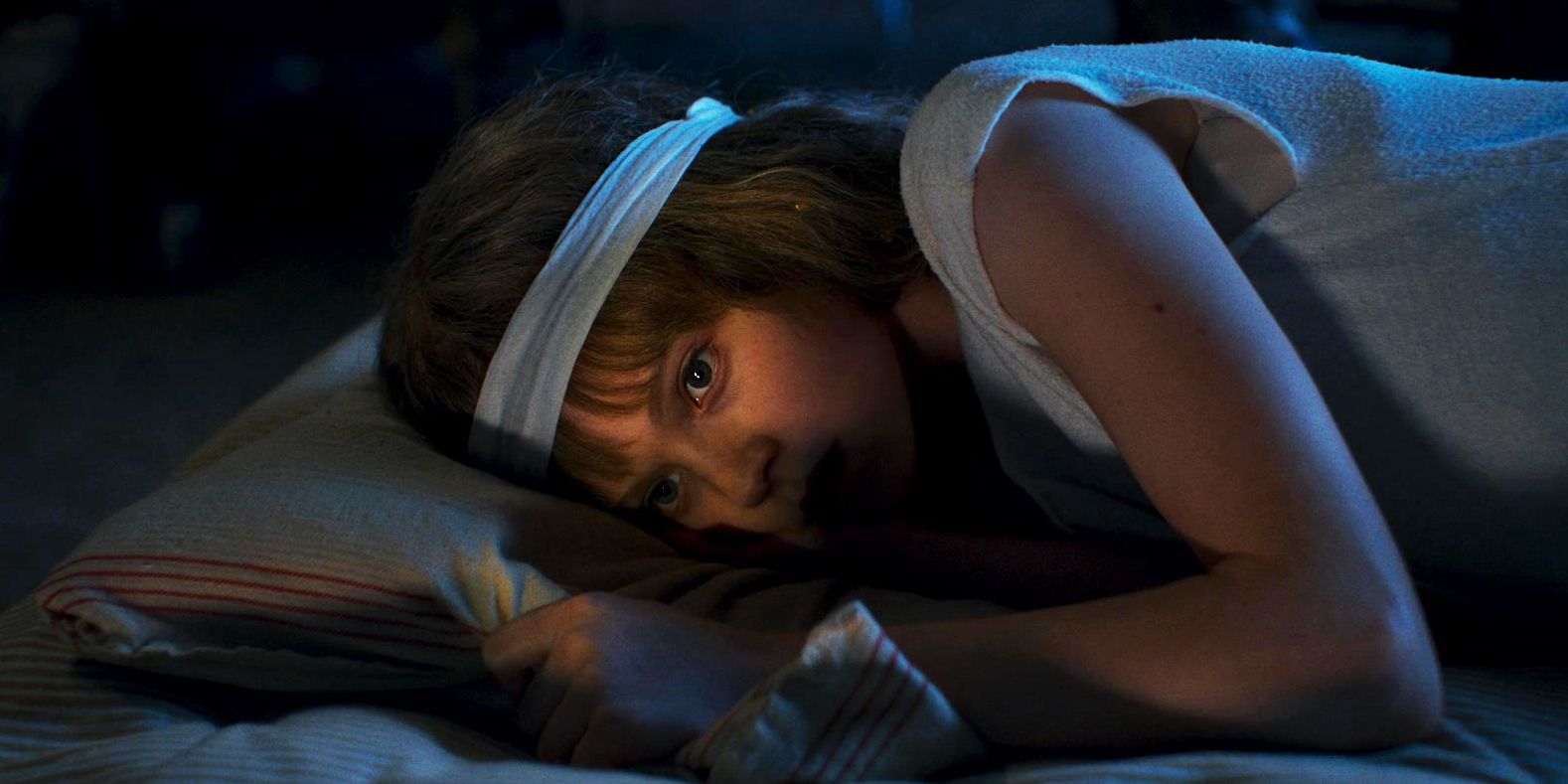 Furiosa young Furiosa awake on her bed wearing the wig