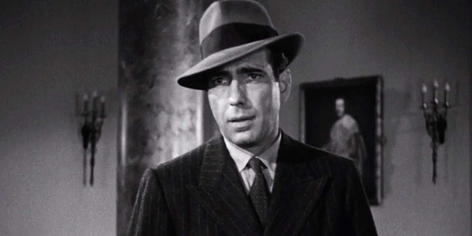Humphrey Bogart sebagai Sam Spade tampak mencurigakan di The Maltese Falcon
