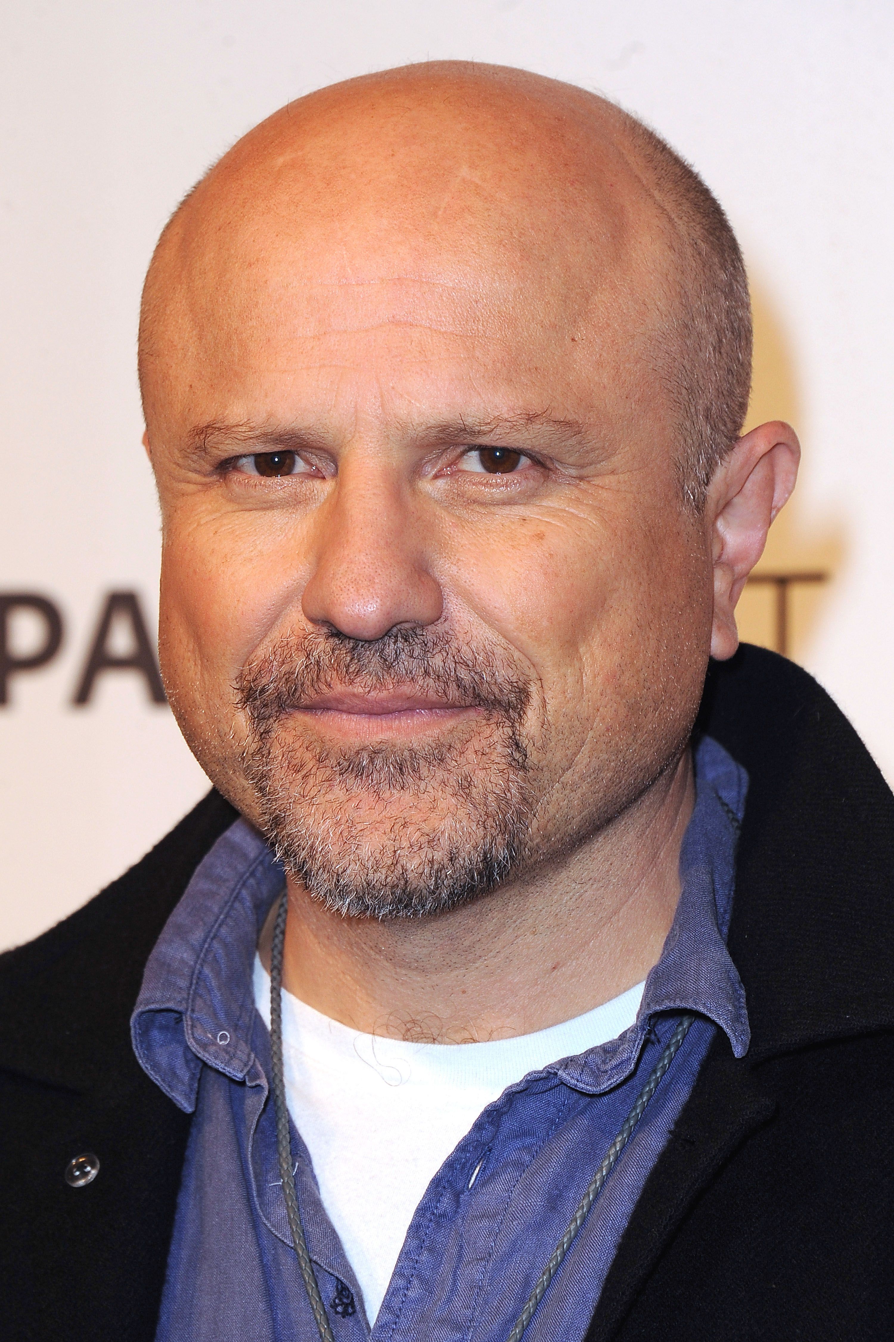 Headshot Of Enrico Colantoni