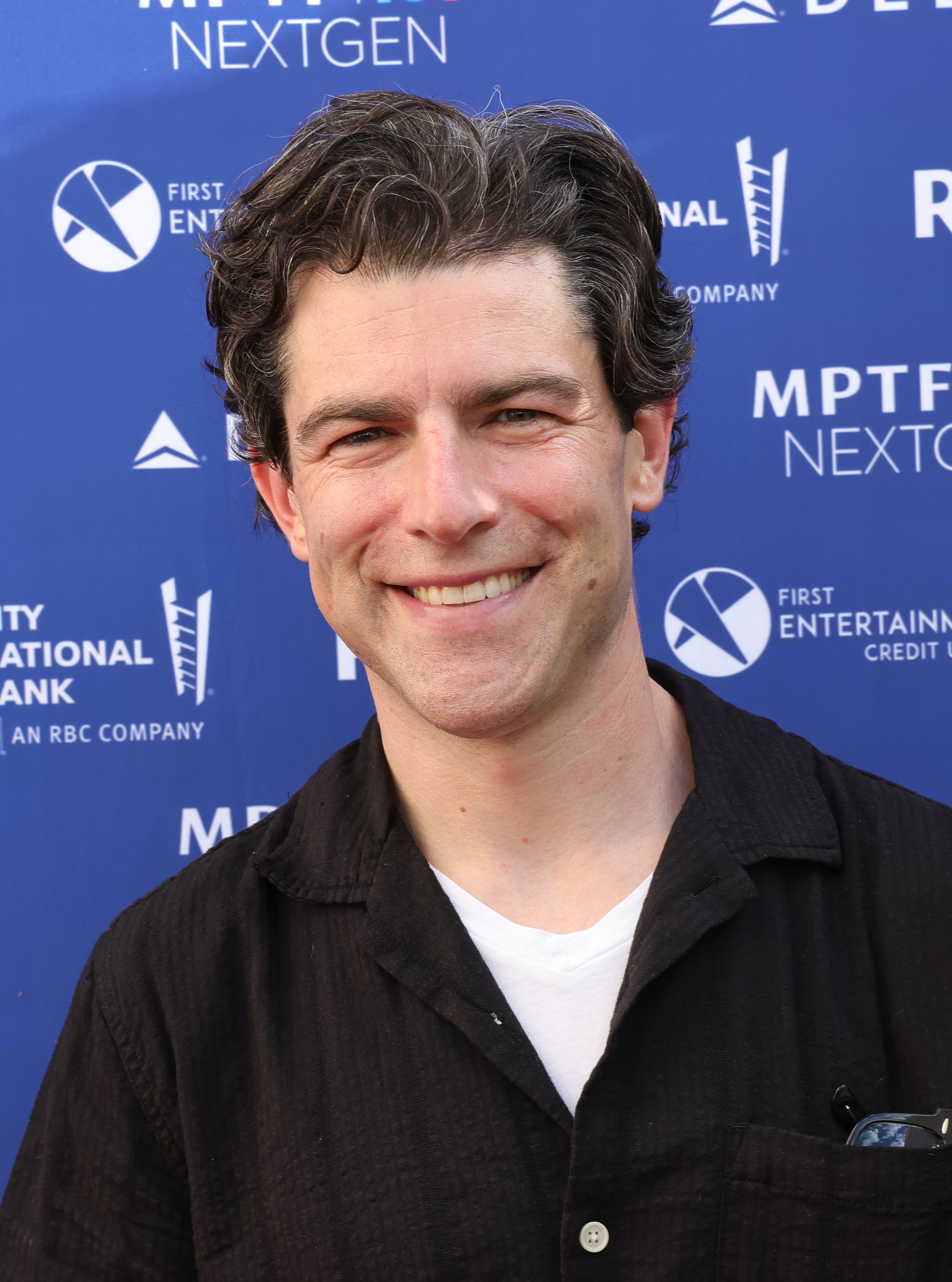 Headshot Of Max Greenfield