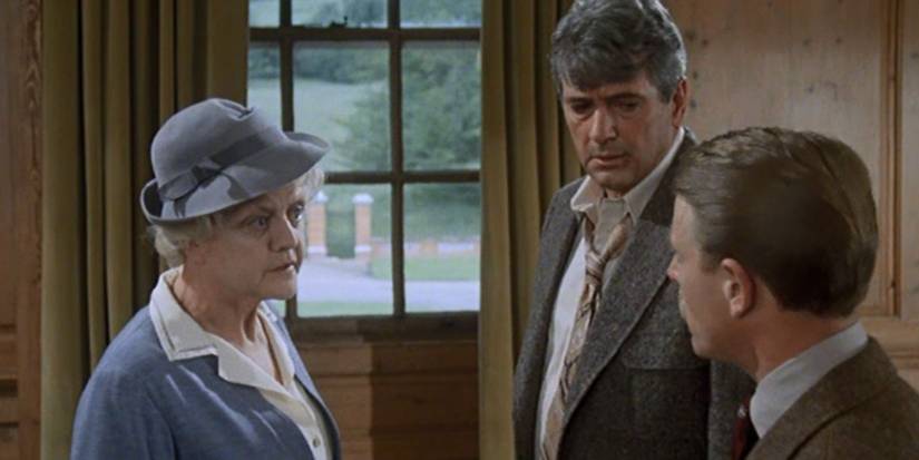 Angela Lansbury as Miss Marple talking with two men