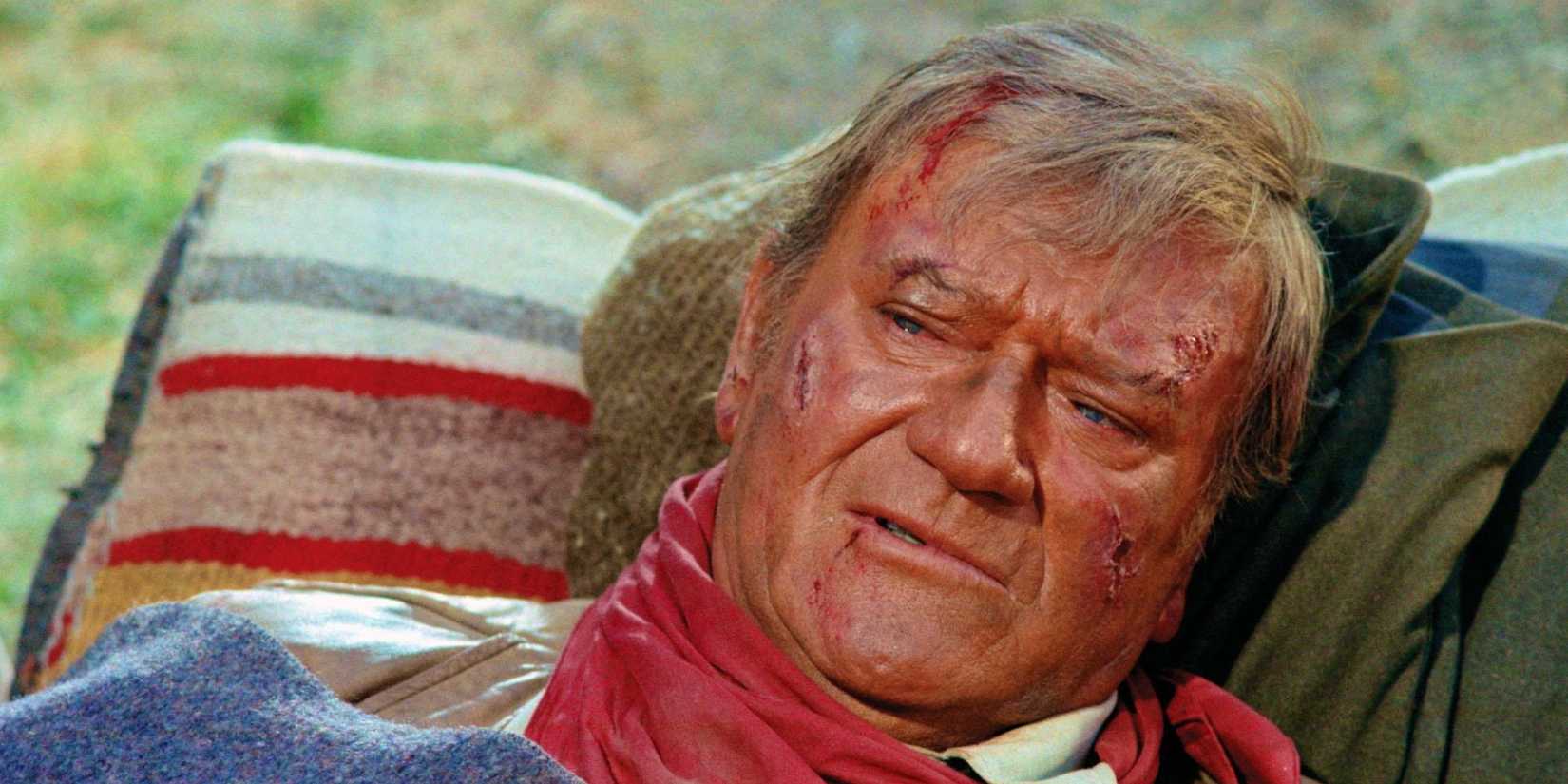 John Wayne as Will Andersen dying in The Cowboys