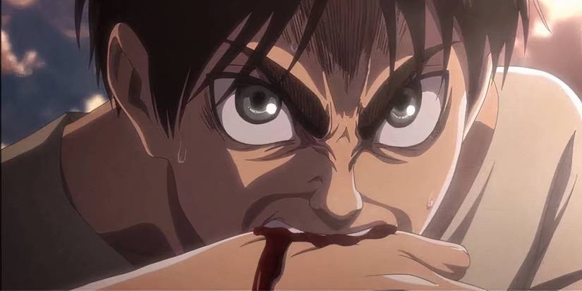 Eren Yeager angrly bites his hand, drawing blood, in Attack on Titan.