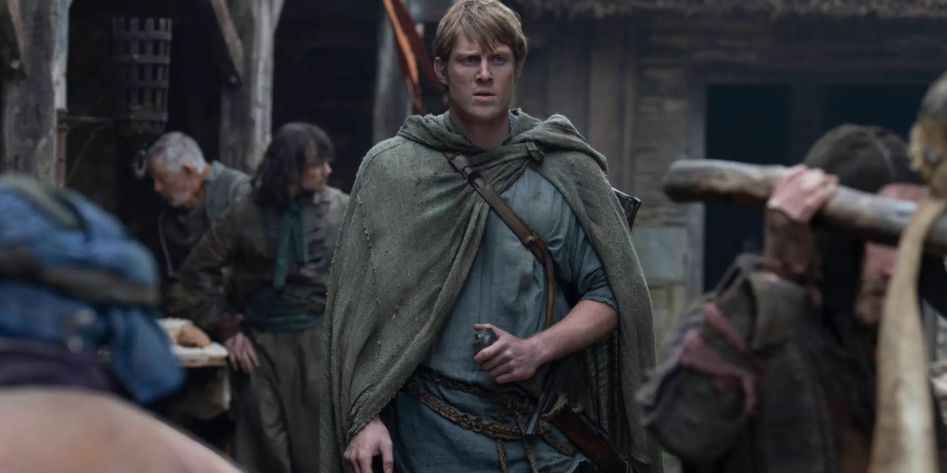 Ser Duncan walks through a crowd with his hand on his sword hilt in A Knight of the Seven Kingdoms