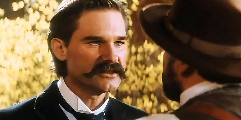 Kurt Russell as Wyatt Earp threatening an unruly bar patron in Tombstone