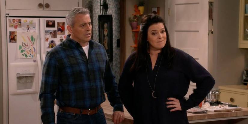 Matt LeBlanc as Adam looking concerned as Liza Snyder as Andi smirks at something in Man with a Plan.