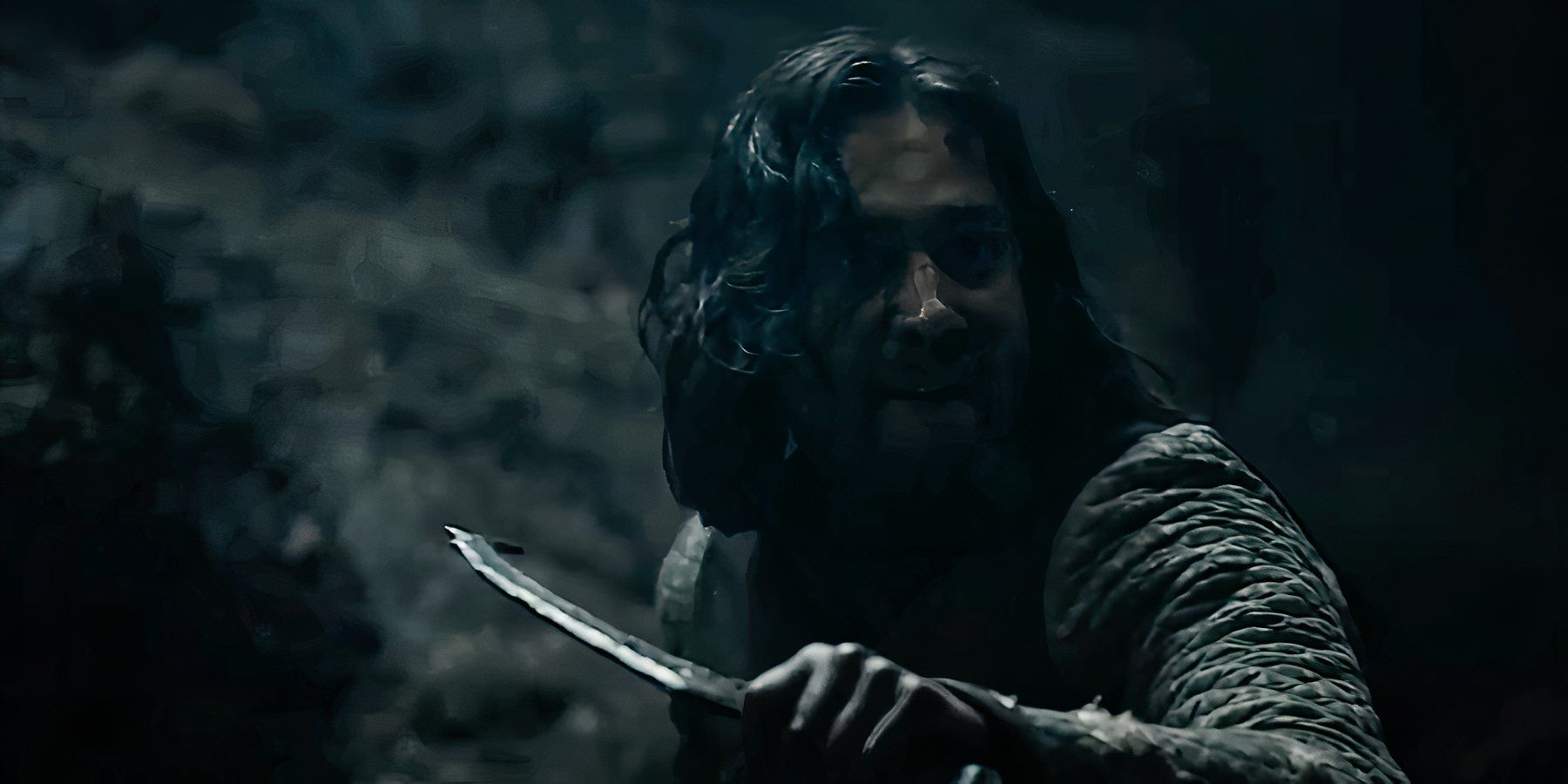 Maxim Baldry as Isildur wielding a knife in The Lord of the Rings The Rings of Power season 2