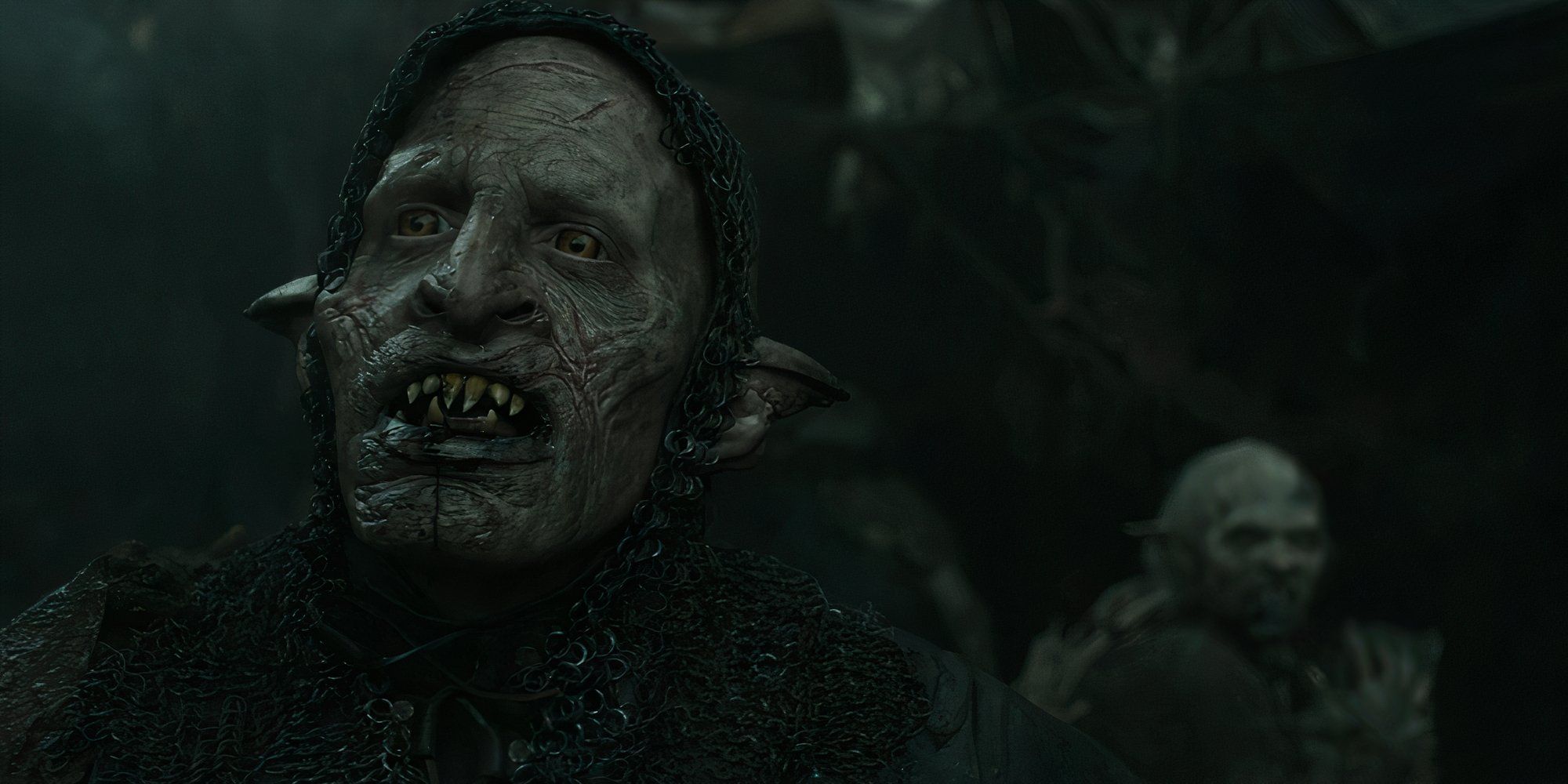 An Orc showing his teeth in The Lord of the Rings: The Rings of Power