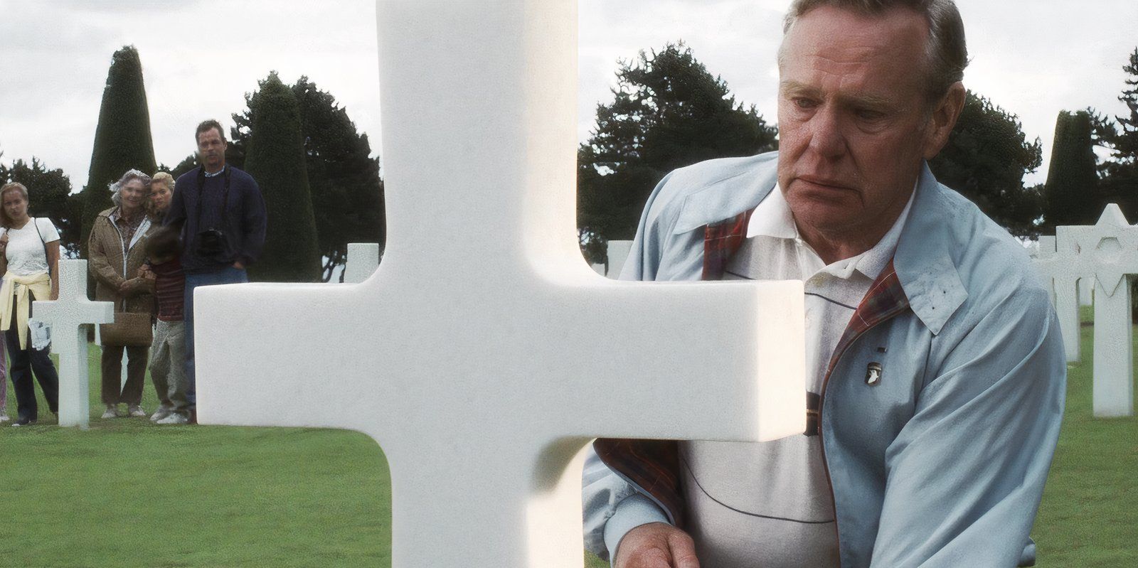 Harrison Richard Young as an older Ryan kneeling by a grave in Saving Private Ryan