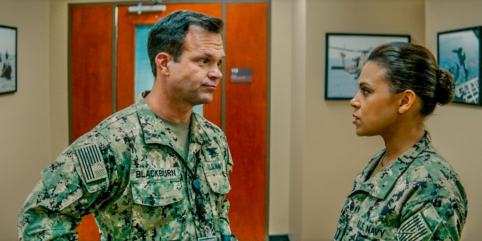 Commander Blackburn (Judd Lormand) having a conversation with Lisa Davis (Toni Trucks) in SEAL Team Season 7 Episode 1