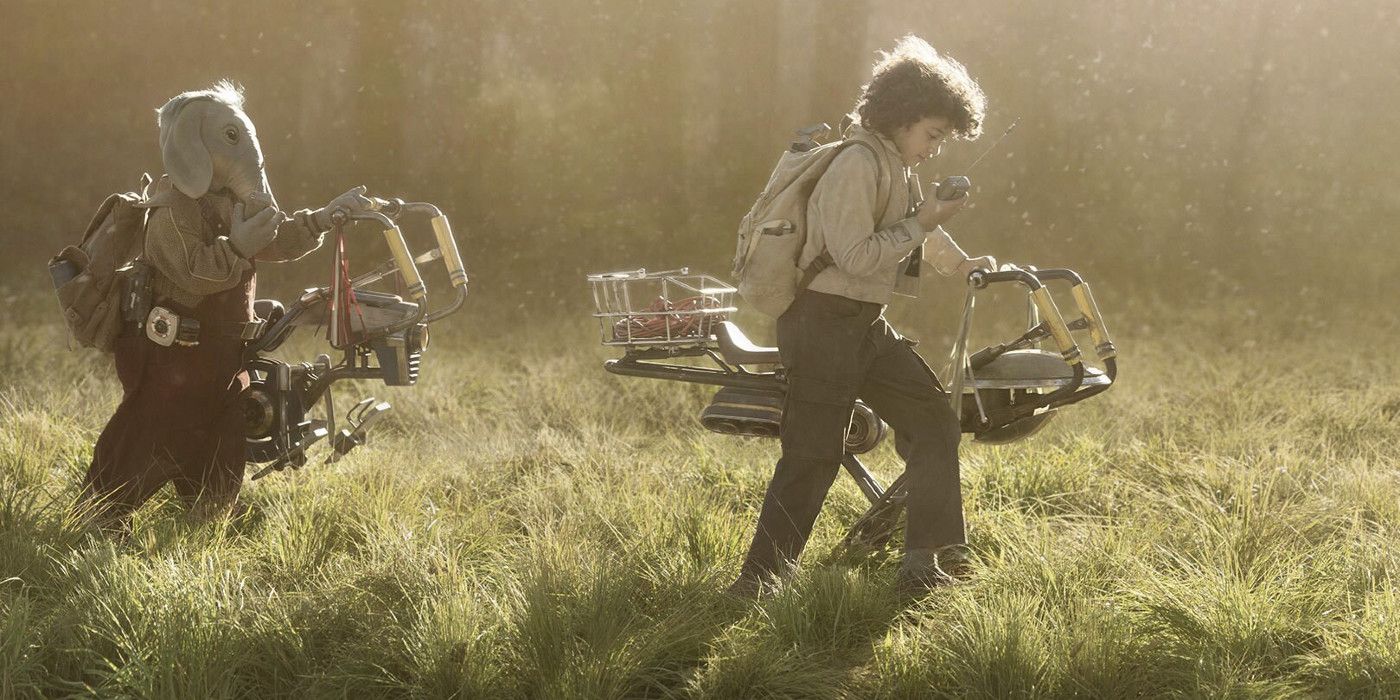 Two young kids, one human and one an alien, walking in a grassy field in Star Wars: Skeleton Crew 