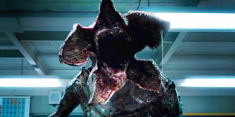 The Demogorgon with its flower mouth open in a classroom in Stranger Things season 1