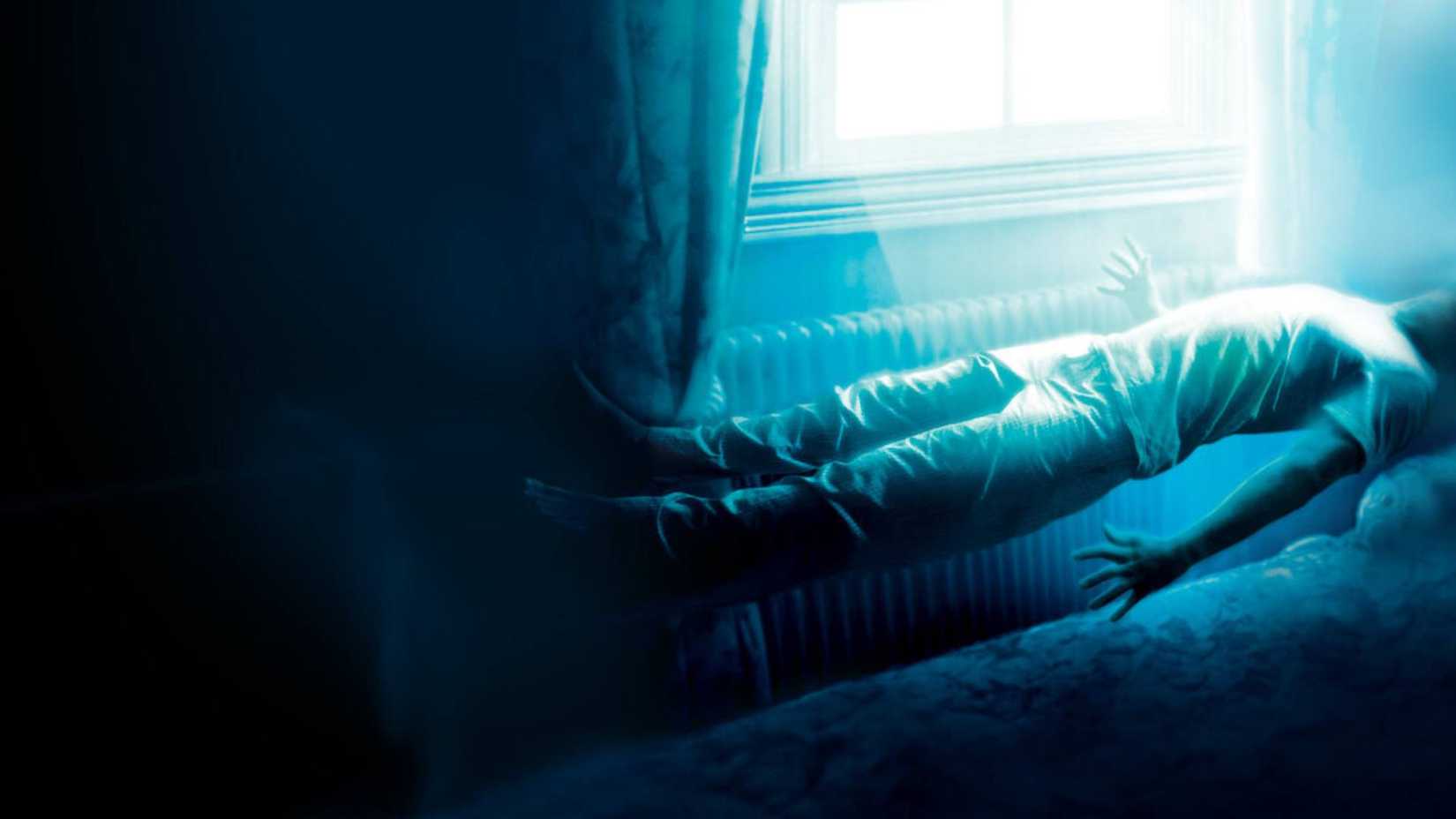 A person floating about their bed about to be abducted in The Fourth Kind