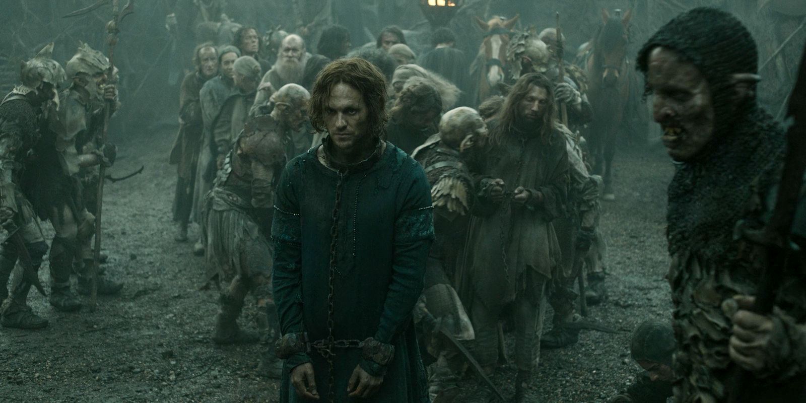 Sauron (Charlie Vickers) is taken prisoner by the orcs and brought before Adar in The Lord of the Rings: The Rings of Power Season 2 Episode 1