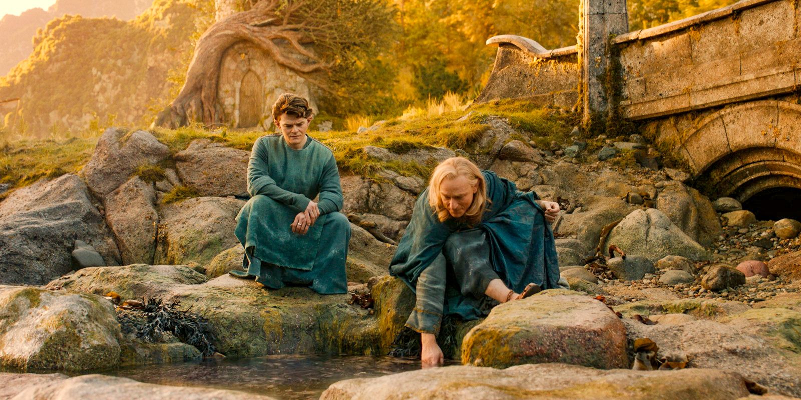 Elrond and Círdan chatting by a stream in The Lord of the Rings: The Rings of Power Season 2 Episode 2