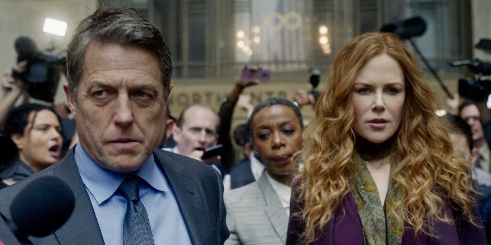 Hugh Grant and Nicole Kidman hounded by press in front of a courthouse in The Undoing