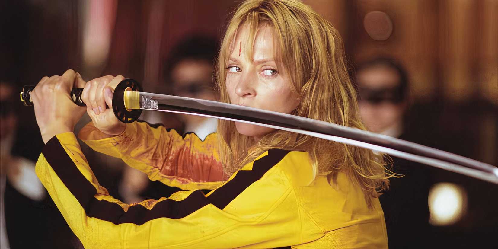 Uma Thurman wears a yellow jumpsuit and bears a sword in Kill Bill: Volume 1