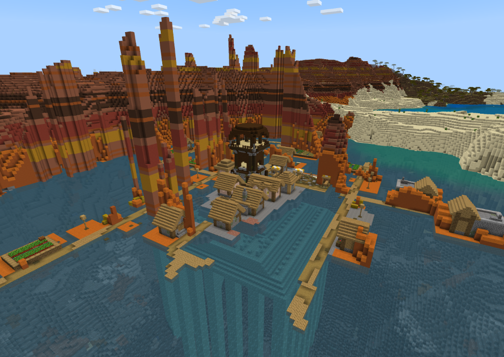 View of a village and pillager outpost in a Badland biome lagoon, with an Ocean Monument underneath in the Wild West PE Seed in Minecraft.
