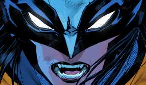 Close up of Laura Kinney as Wolverine, bearing her sharp teeth beneath her masked eyes.