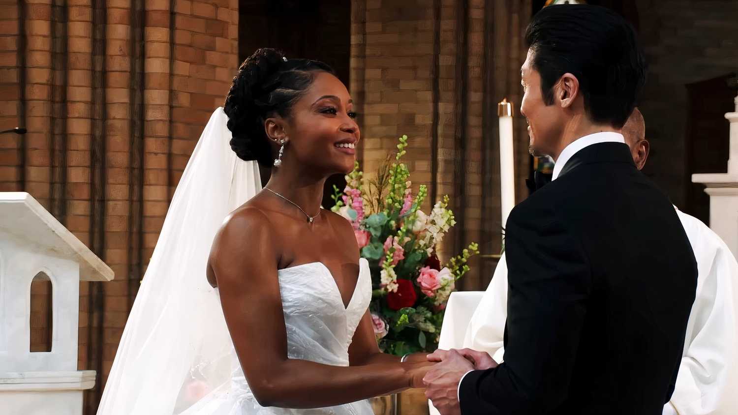 Yaya DaCosta as April Sexton and Brian Tee as Ethan Choi getting married in Chicago Med.