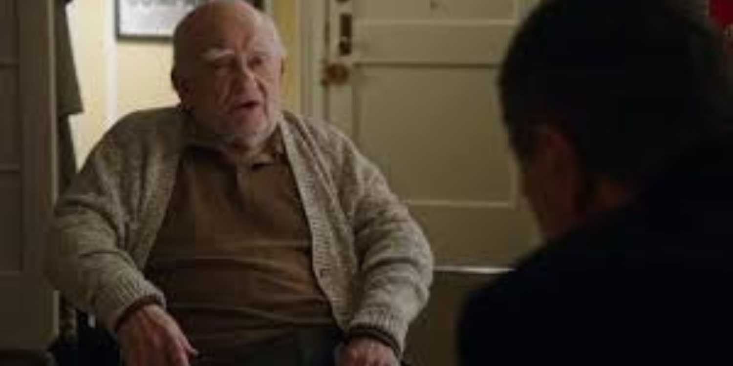 Blue Bloods Ed Asner in a wheelchair talking to Frank