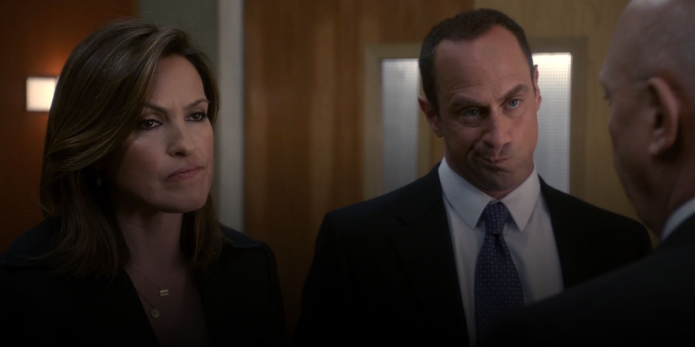 Law & Order: SVU Stabler with a weird look on his face while he and Benson talk with Cragen