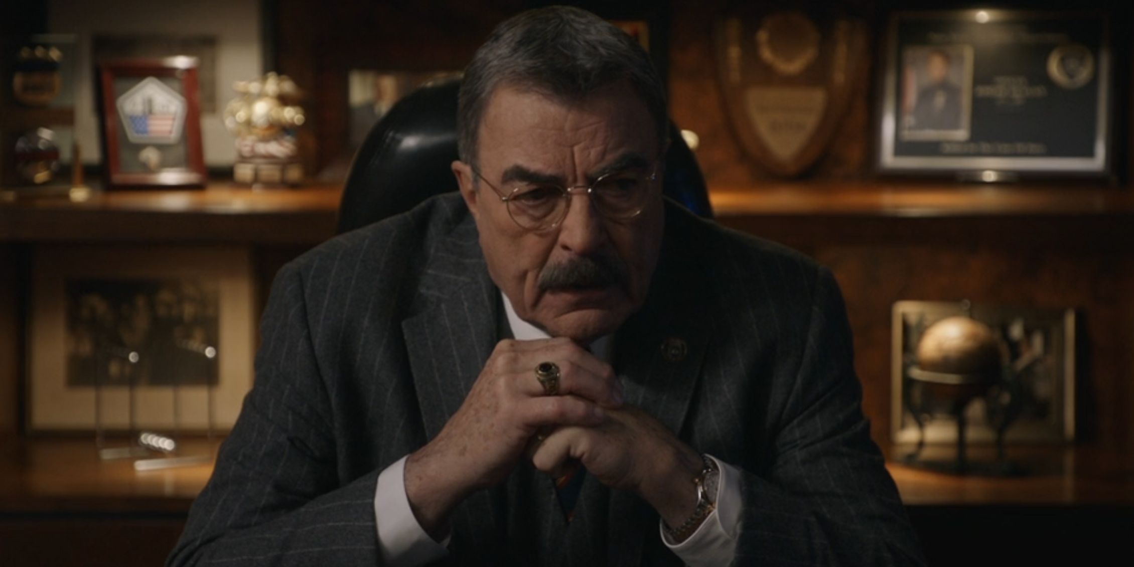 Blue Bloods' Frank sitting with his hands clasped 