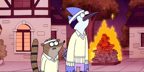 Mordecai and Rigsby in front of a burning pile of toilets in Regular Show