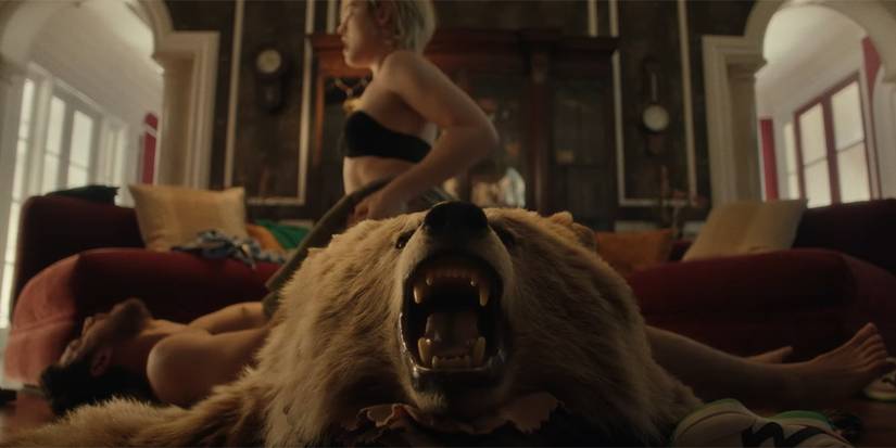 A bearskin run laying in front of two people hooking up in Bone Lake