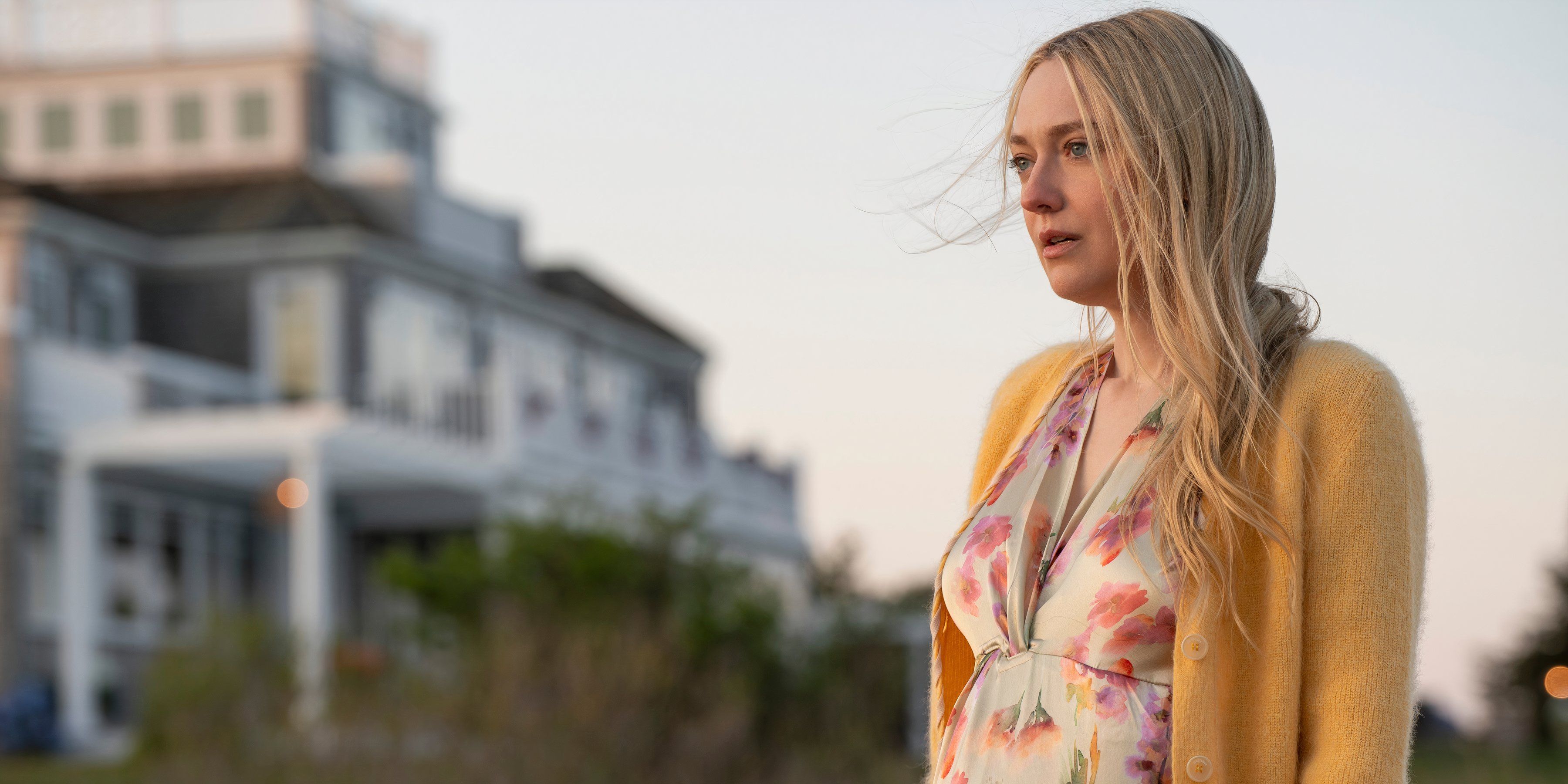 Abbey looks to the side while standing outside the house in The Perfect Couple episode 5