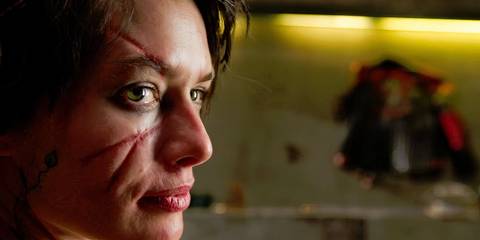 Lena Headey as Ma Ma in Dredd (2012) looking offscreen