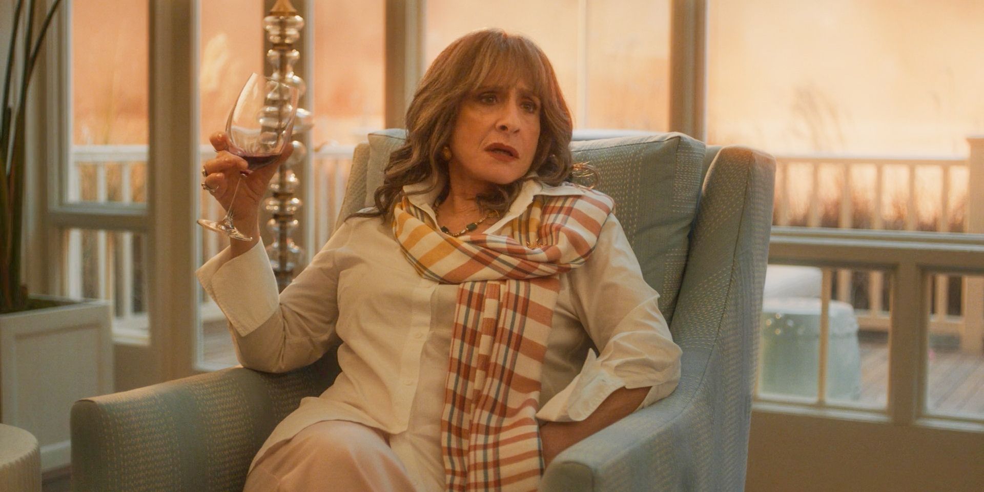 Lilia Calderu (Patti LuPone) drinking a glass of wine in Agatha All Along Season 1 Episode 3