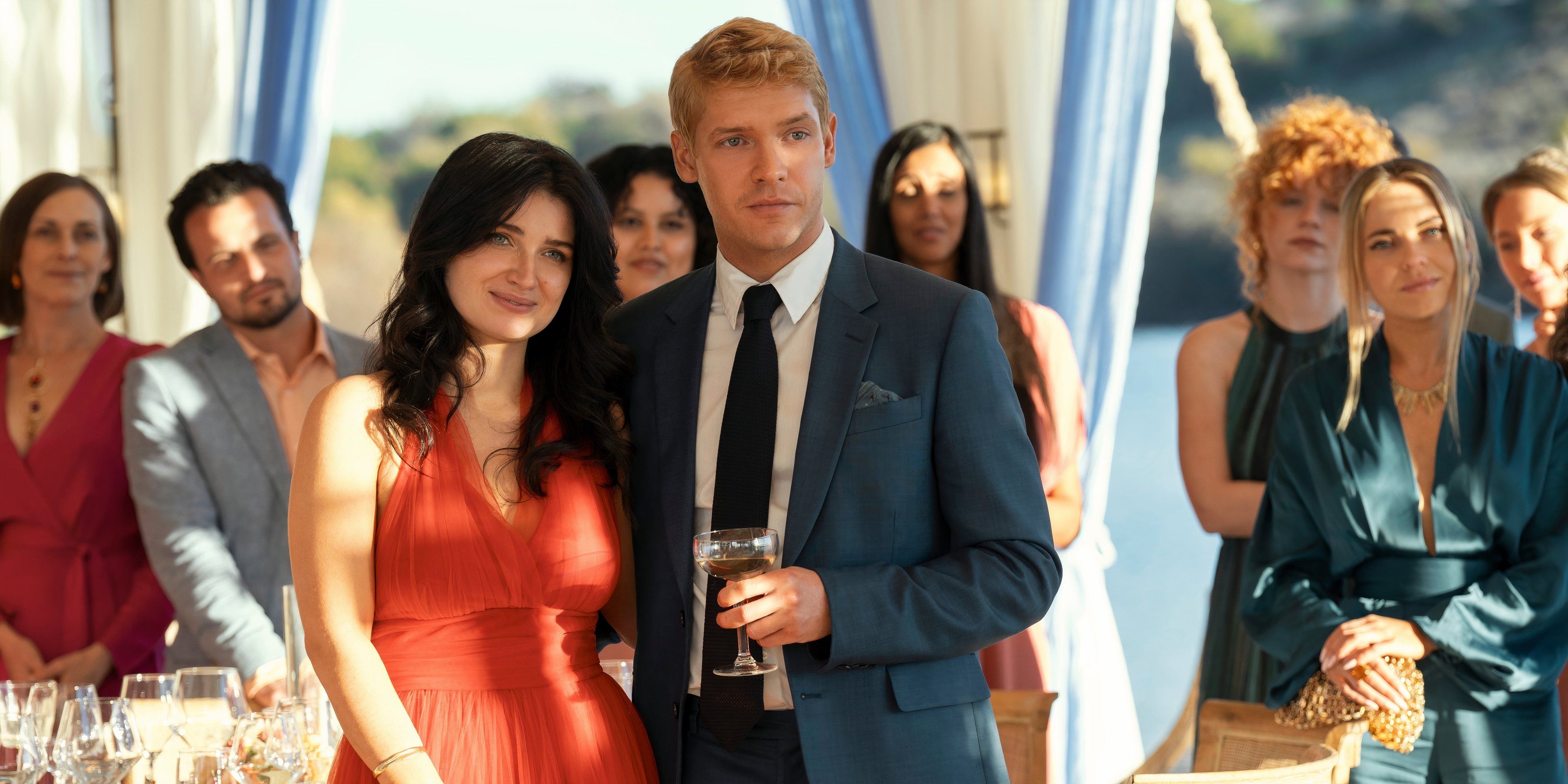 Amelia and Benji stand together at their reception in The Perfect Couple episode 1