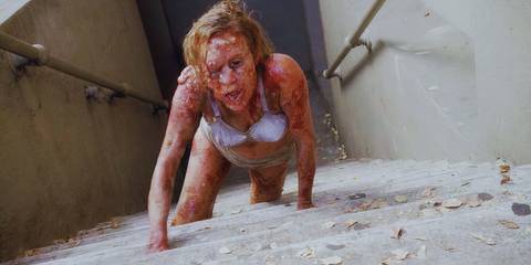 Shelley (played by Chloe Sevigny) crawling in a poor state in American Horror Story: Asylum