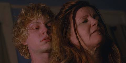 Kyle (played by Evan Peters) looking at his mother (played by Mare Winningham) with hatred in American Horror Story: Coven