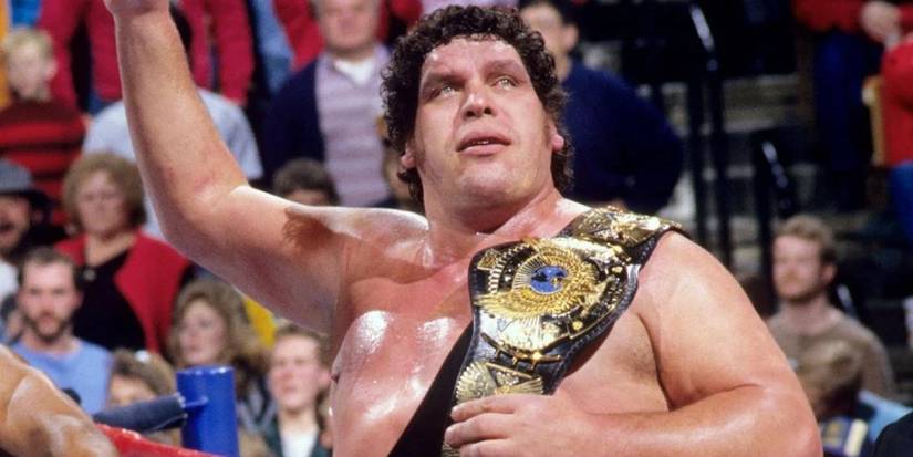 Andre the Giant holding the WWE Championship after defeating Hulk Hogan at The Main Event
