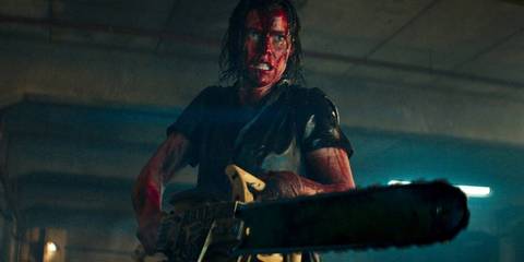 Beth with a chainsaw in Evil Dead Rise