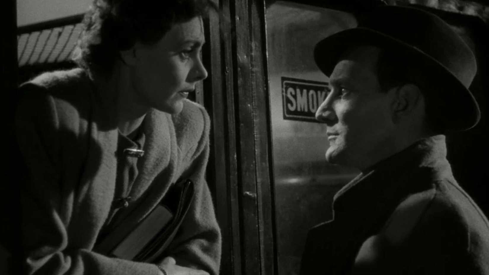 Celia Johnson and Trevor Howard gaze at each other through a train window in Brief Encounter (1945)